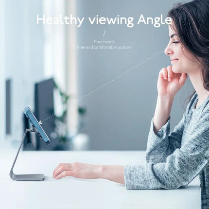 R-JUST Round Desktop Magnetic Holder for Stable Phone Placement showing woman using phone hands-free at healthy viewing angle on aluminum stand