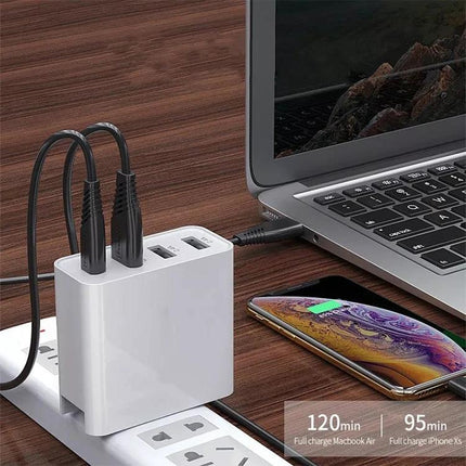 A3 PD 18W USB C Travel Charger Quad USB Ports QC3.0 Fast Charge US EU UK Plugs — white 4-port travel charger next to laptop and smartphone
