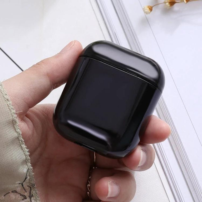 A Protective Case for AirPods During Daily Activities in glossy black electroplated TPU held in hand to prevent scratches and dust