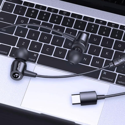 Awei In-Ear Earphones for Daily Commutes and Work — black in-ear earphones with inline controls and USB‑C plug on laptop keyboard