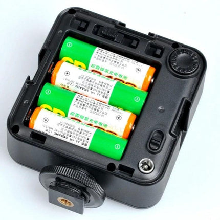 Godox LED64 Video Light for Photography and Video Shooting showing battery compartment with three AA batteries and mounting foot