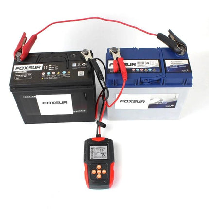 Foxsur Car Battery Tester for Everyday Vehicle Maintenance showing tester connected to two car batteries with clamps and digital display