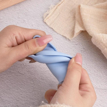 Xiaomi Earbuds Protective Case with Hook for Everyday Use showing hands stretching soft blue silicone case with hook and 360-degree coverage