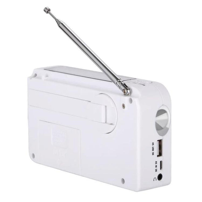 Portable Solar-Powered AM/FM Radio with Flashlight and Dynamo Charger white emergency radio showing antenna, USB port, hand-crank and flashlight