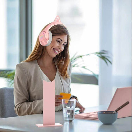 Onikuma Headset Stand For Desk Organization And Tidy Storage pink stand holding headset beside woman at tidy desk