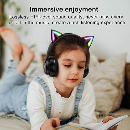 Onikuma Cat Ear Wireless Headphones For Gaming, Music And Calls on kid reading with RGB cat ear lights and comfy ear cushions