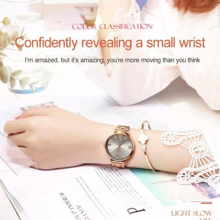JIN SHI DUN Elegant Waterproof Women's Quartz Watch on a woman's wrist with tungsten steel strap, Roman numerals, elegant bracelet styling