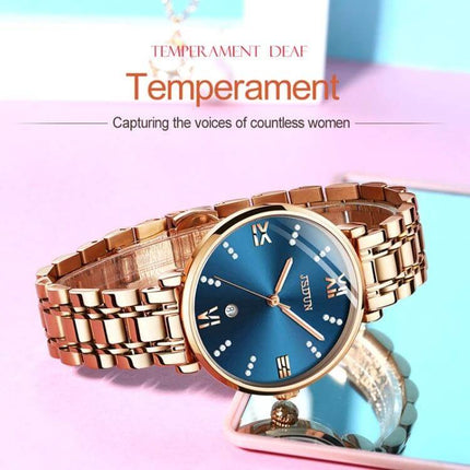 JIN SHI DUN Elegant Waterproof Women's Quartz Watch rose gold tungsten steel strap with blue dial and Roman numerals, 30m water resistant