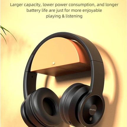 Awei Foldable Wireless Headphones For Commuting And Remote Work black foldable Bluetooth headphones on wall hook, travel-ready