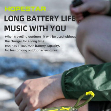 HOPESTAR Portable Bluetooth Speaker For Home And Outdoor shown on beach with long battery life and splash-resistant design