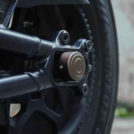 Aluminum Rear Axle Nut Covers for Harley Sportster S installed on rear axle, hard-anodized finish protecting hardware from dirt and moisture
