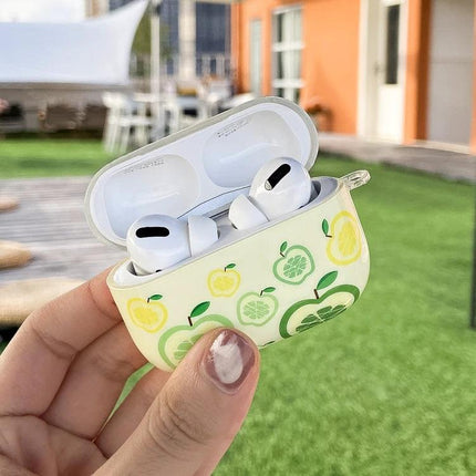 IMD Original Protective Case for AirPods Pro Everyday Use – white AirPods Pro in apple-patterned protective case held outdoors