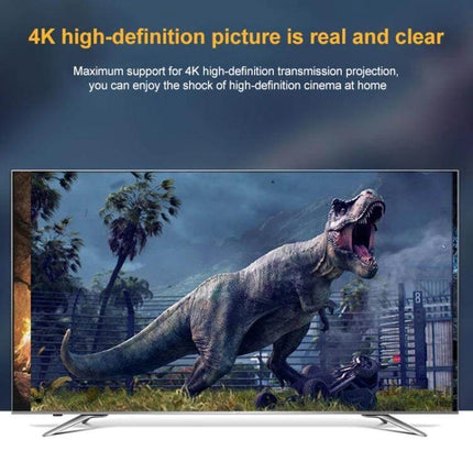 USB-C Charging and Data Transfer Cable with Elbow Connector coiled beside 4K TV showing dinosaur scene, ideal for tight desk or travel charging and 10Gbps data