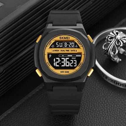 SKMEI Electronic Watch with Silicone Strap for Daily Timekeeping - black digital watch with gold accents, stopwatch, dual time and 50M water resistance