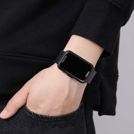 SKMEI Waterproof Electronic Watch for Everyday Activities worn on wrist, black rectangular digital face, 50m water-resistant, durable for swimming and workouts