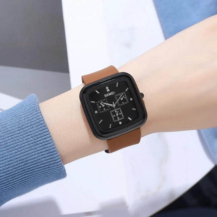 SKMEI Silicone Strap Waterproof Quartz Watch for Everyday Timekeeping on wrist with brown silicone band and black square dial