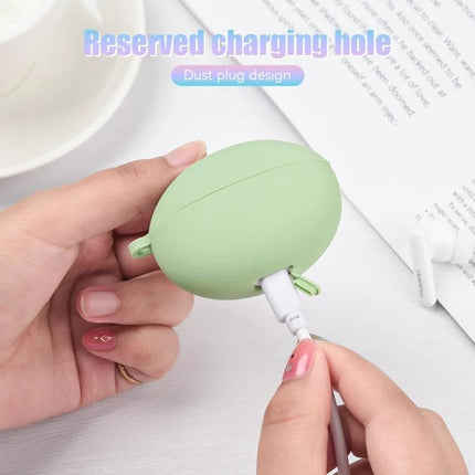 Protective Silicone Case for Huawei Earbuds in Daily Use — green silicone case with reserved charging hole and dust plug being connected to charger