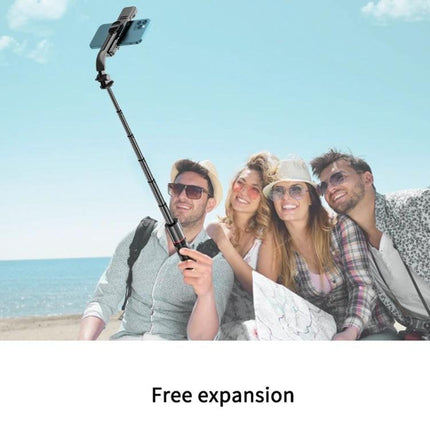 Extendable selfie stick for daily photos and videos on trips or at home used by friends on a beach with built-in lights for better group shots