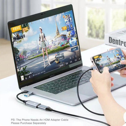 HDMI to USB-C Video Capture Device for Screen Recording connected from smartphone to laptop capturing mobile game footage on aluminum capture adapter
