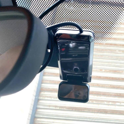 Dual Camera WiFi Car Dash Cam for Secure Driving Footage installed behind rearview mirror with WiFi and dual lenses
