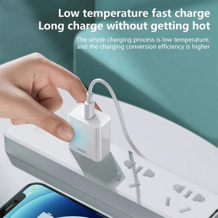 REMAX Charger for Everyday Device Power on the Go showing a 20W PD white wall charger plugged into a power strip charging a smartphone, low temperature fast charge