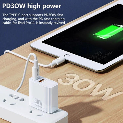 REMAX Charger for Daily Device Powering at Home and Travel - white 30W dual-port USB-C charger powering tablet on desk