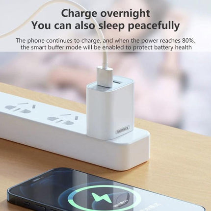 Charge Your Devices with This REMAX Set for Daily Use — dual USB charger on power strip charging phone on nightstand