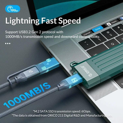 Orico Enclosure for M.2 SATA SSDs, Ideal for Portable Storage Expansion shown connected to laptop for 1000MB/s USB portable storage