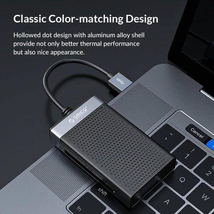 Orico 4-in-1 USB-C Multifunction Card Reader for Simultaneous Use on laptop showing SD, MicroSD, CF and MS slots in aluminum alloy design
