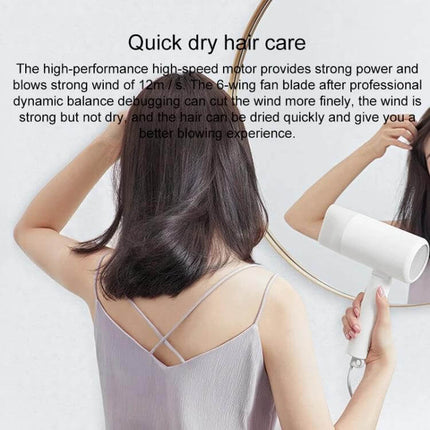 Xiaomi Mijia Negative Ion Portable Hair Dryer With Foldable Handle - woman using compact white dryer for quick dry hair care