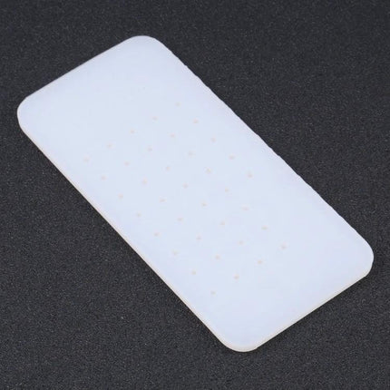 Silicone Glue Removal Pad for iPhone Repair and Maintenance white silicone pad used to remove adhesive during screen repair and lamination