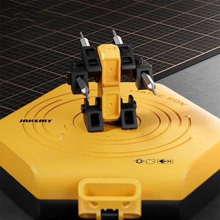 JAKEMY Multi-Function Screwdriver Tool Set with Assemblable Blocks neatly arranged on yellow base display for compact repairs and creative assembly
