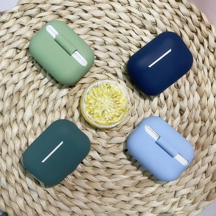 Silicone Protective Case for Everyday Earphone Use in pastel green, navy, teal, and light blue on woven mat, slim charging-friendly design