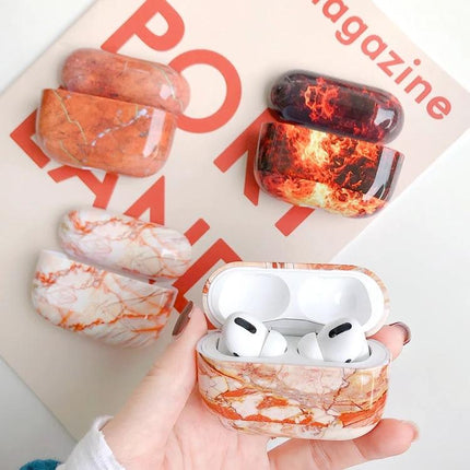 Marble Protective Case for Everyday Earphone Protection - orange marble AirPods case with earphones inside