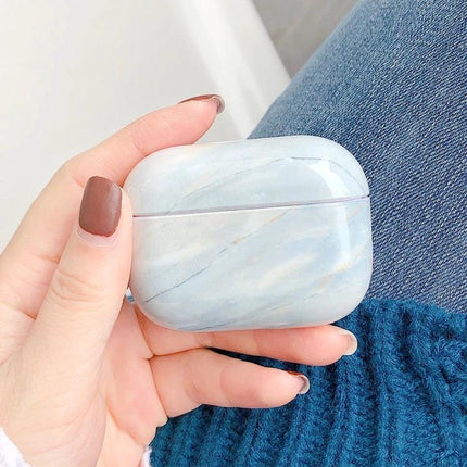 Marble Protective Case for Everyday Earphone Protection – white marble-textured case held in hand for pocket-safe, scratch-resistant earphone storage