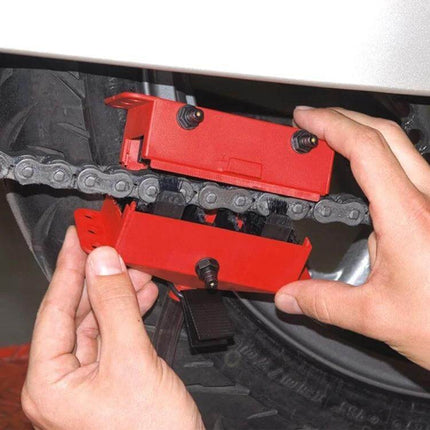 Motorcycle Chain Cleaning Kit For Chains And Sprockets being applied to a motorcycle chain for cleaning and lubrication
