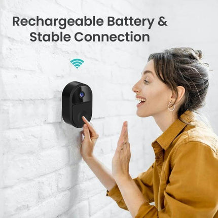 Wireless Mini Smart Video Doorbell with Two-Way Audio mounted on wall as woman uses two-way audio and rechargeable battery wireless connection