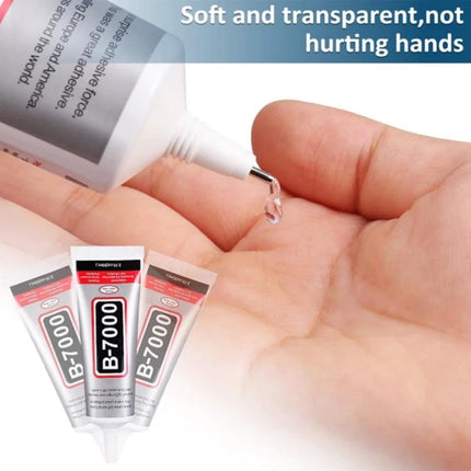 B-7000 Multi-Purpose Adhesive Glue for Everyday Material Bonding showing clear glue drop from tube onto hand, ideal for plastic, glass, crafts and electronics repairs
