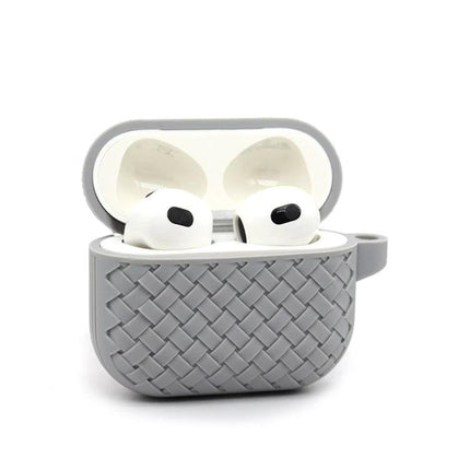 Protective Case for Safeguarding AirPods in Daily Life gray woven silicone case with charging access and AirPods inside