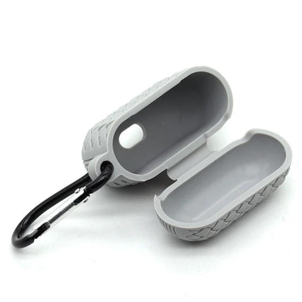 Protective Case for Safeguarding AirPods in Daily Life - gray silicone case with carabiner, built-in charging port access, open view