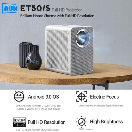 AUN ET50 Portable LED Mini Projector for Home Viewing projecting a movie on a living room wall, compact white cube design