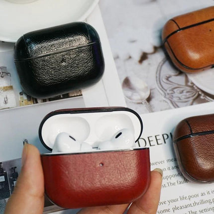 Leather Case Protects Earphones for Everyday Use — brown leather protective earbud case with quick-access charging opening