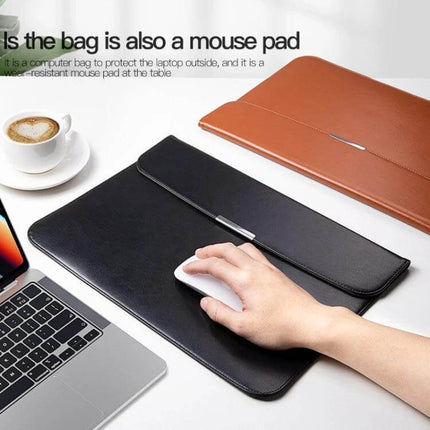 Protective PU Leather Laptop Sleeve for 13-16 Inch Devices shown used as a slim black mouse pad and sleeve next to laptop and coffee