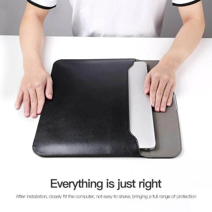 Protective PU Leather Laptop Sleeve for 13-16 Inch Devices - black sleeve with soft interior lining and laptop partially inserted
