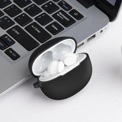 Protective Case for Realme Earphones During Daily Activities shown open beside laptop, black silicone cover protecting earbuds