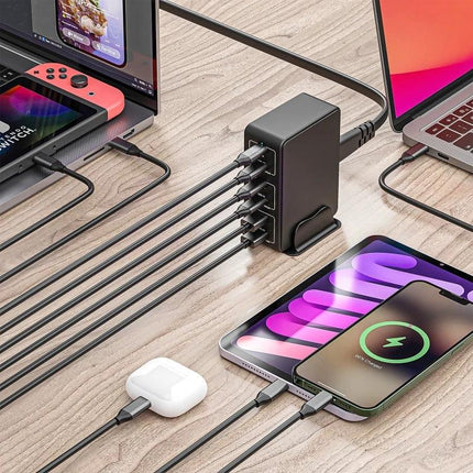 Multi-Port Desk Charger for Everyday Home Device Needs powering six devices on a desk with phones, laptop, tablet and earbuds