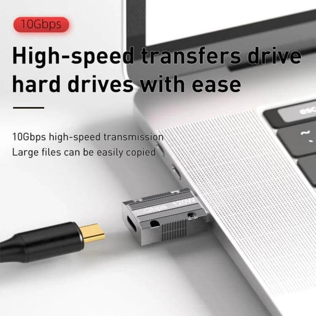 USB-C to USB 3.0 Zinc Alloy Adapter for Charging and Data plugged into laptop for high-speed 10Gbps file transfers, durable zinc alloy construction