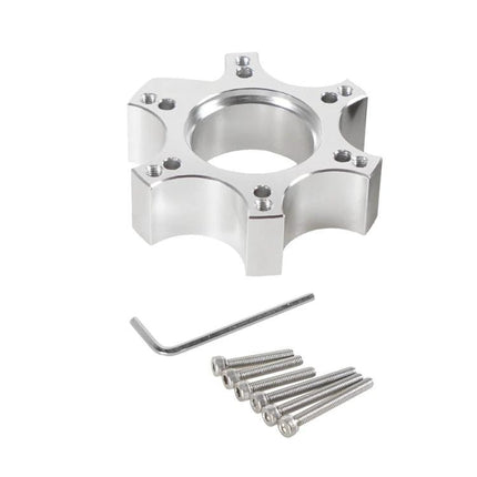 Thrustmaster Adapter Enhances Home Racing Simulator Experiences - silver wheel hub adapter with screws and hex key