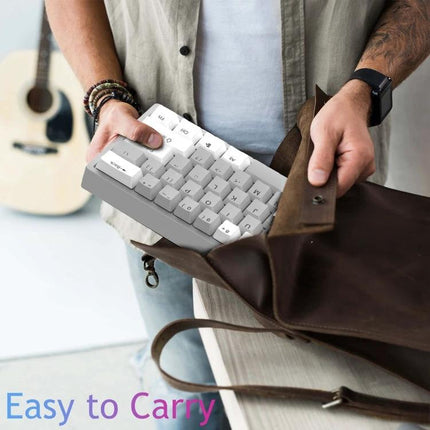 AULA Ergonomic 61-Key Wired RGB Mechanical Keyboard for Gaming compact white keyboard being placed into a bag, easy to carry
