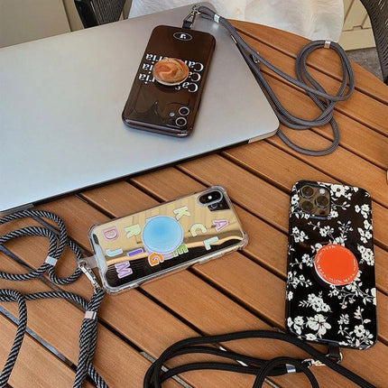 Hands-Free Universal Mixed Color Mobile Phone Lanyard with three smartphones on a wooden table, secure hands-free carry